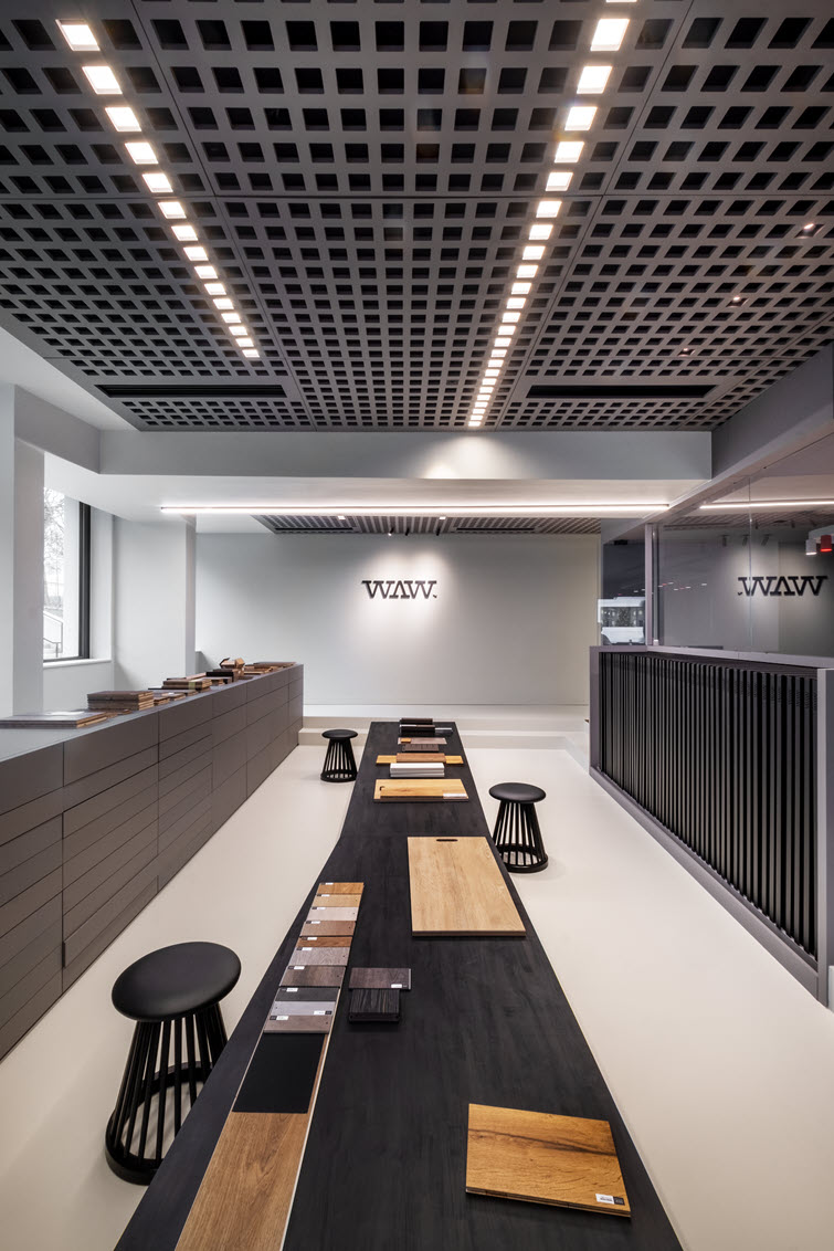 Showroom with cabinets entirely made of grey decorative MDF from Unilin Panels